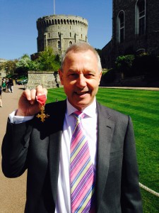 Business West director Clive Wray presented with his OBE by the Queen